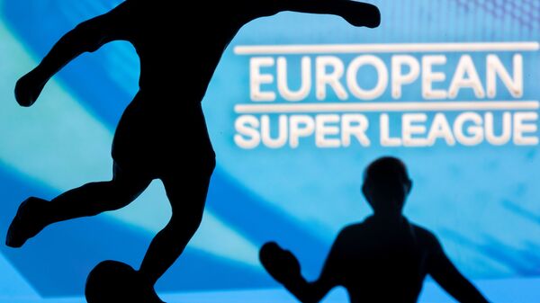 Metal figures of football players are seen in front of the words European Super League in this illustration taken April 20, 2021 - Sputnik International