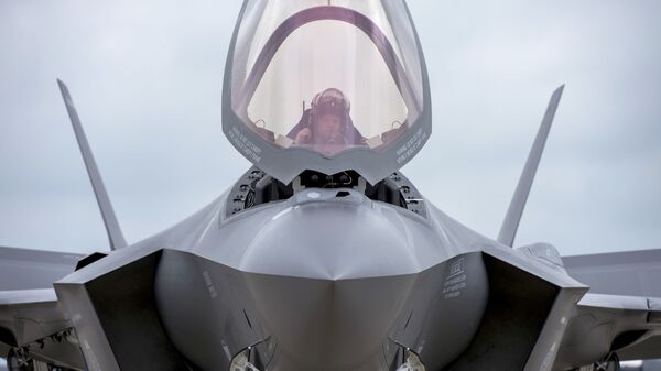 Maj. Will Andreotta, F-35 Lightning II Heritage Flight Team pilot from Luke Air Force Base, Az., prepares to exit the cockpit at Joint Base Andrews, Md., Sept. 20, 2016. The aircraft is here to perform a fly-over during the U.S. Air Force Tattoo at Joint Base Anacostia-Bolling, Washington, D.C., Sept. 22, 2016.  - Sputnik International