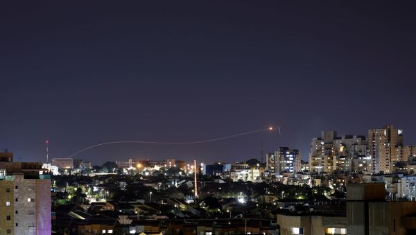 Iron Dome anti-missile system fires an interceptor missile as a rocket is launched from Gaza towards Israel, as seen from the city of Ashkelon, Israel April 24, 2021. - Sputnik International