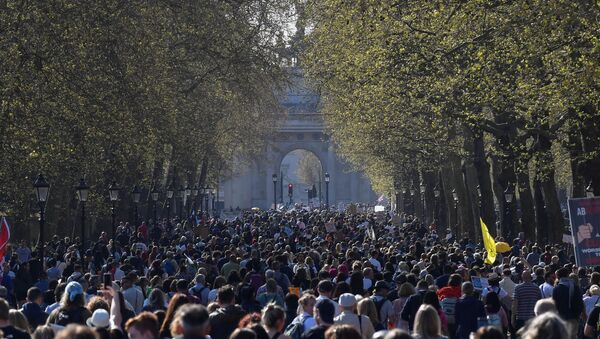 Demonstrators march during an anti-lockdown 'Unite for Freedom' protest, amid the spread of the coronavirus disease (COVID-19), in London, Britain, April 24, 2021 - Sputnik International