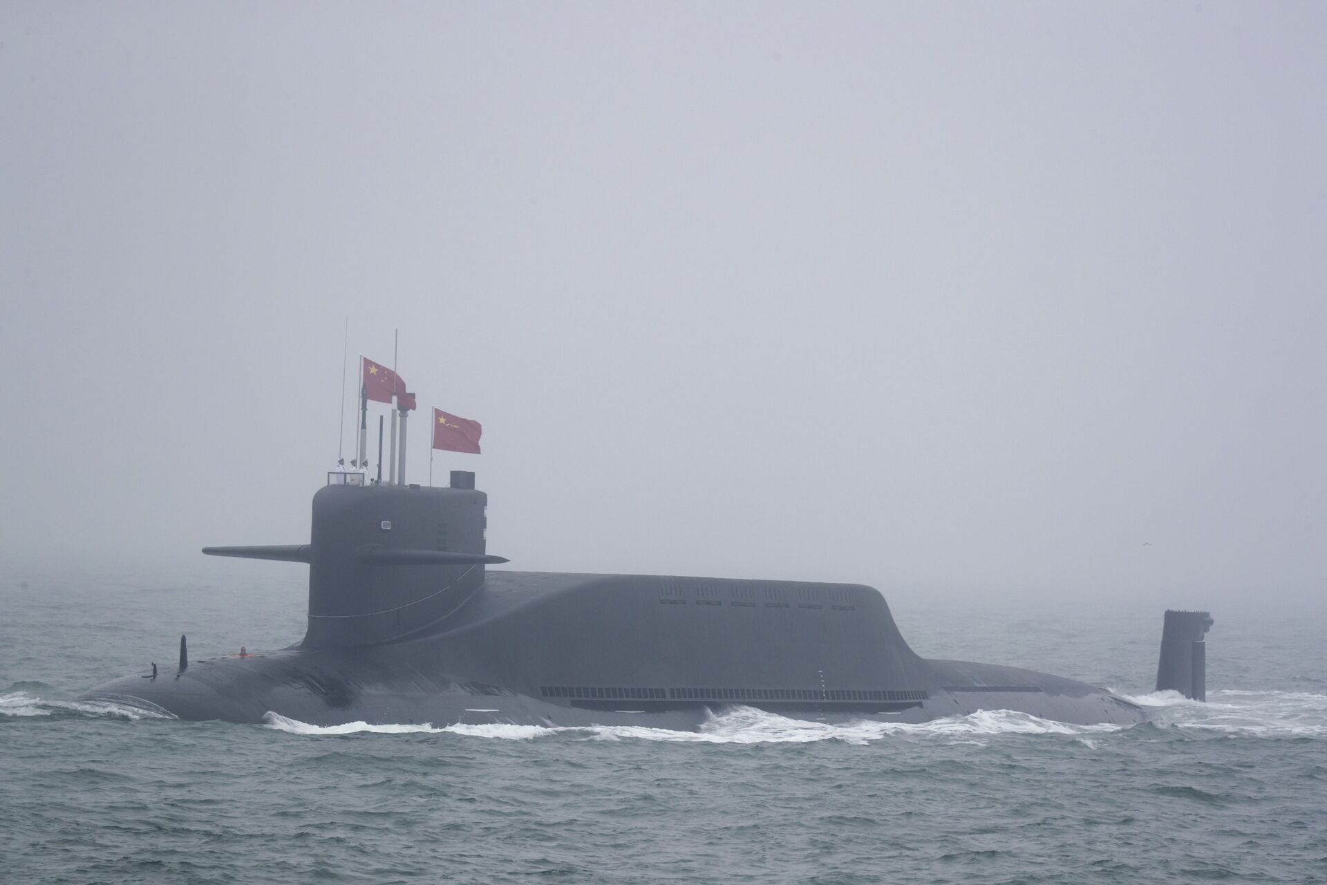 A new type 094A Jin-class nuclear submarine Long March 10 of the Chinese People's Liberation Army (PLA) Navy participates in a naval parade to commemorate the 70th anniversary of the founding of China's PLA Navy in the sea near Qingdao in eastern China's Shandong province, Tuesday, April 23, 2019 - Sputnik International, 1920, 08.10.2021