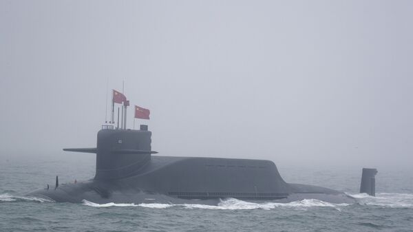A new type 094A Jin-class nuclear submarine Long March 10 of the Chinese People's Liberation Army (PLA) Navy participates in a naval parade to commemorate the 70th anniversary of the founding of China's PLA Navy in the sea near Qingdao in eastern China's Shandong province, Tuesday, April 23, 2019 - Sputnik International