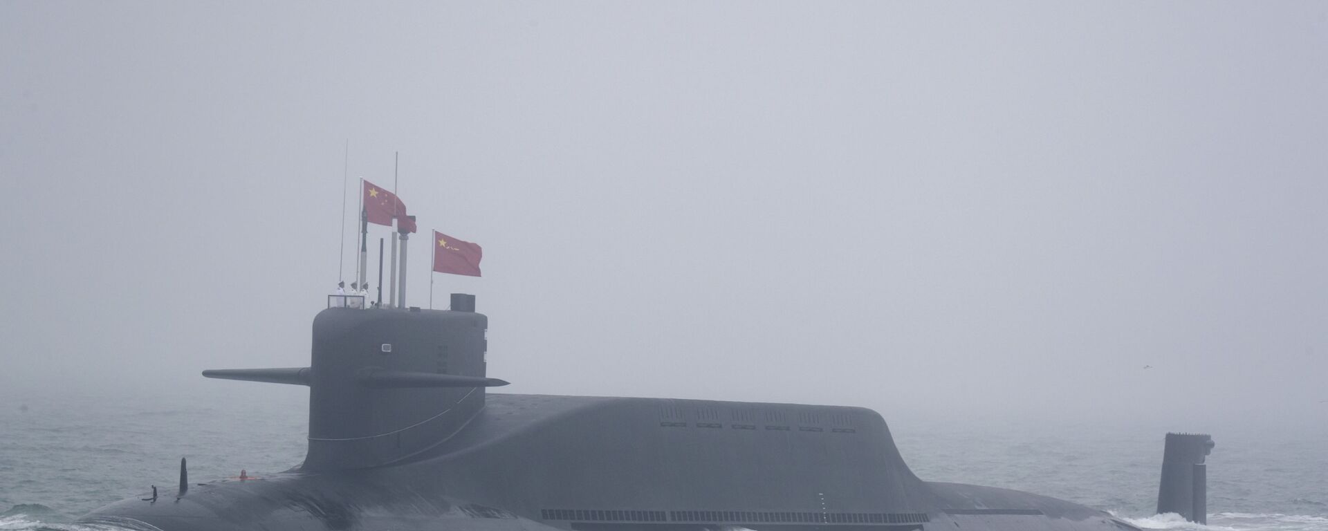 A new type 094A Jin-class nuclear submarine Long March 10 of the Chinese People's Liberation Army (PLA) Navy participates in a naval parade to commemorate the 70th anniversary of the founding of China's PLA Navy in the sea near Qingdao in eastern China's Shandong province, Tuesday, April 23, 2019 - Sputnik International, 1920, 20.08.2024