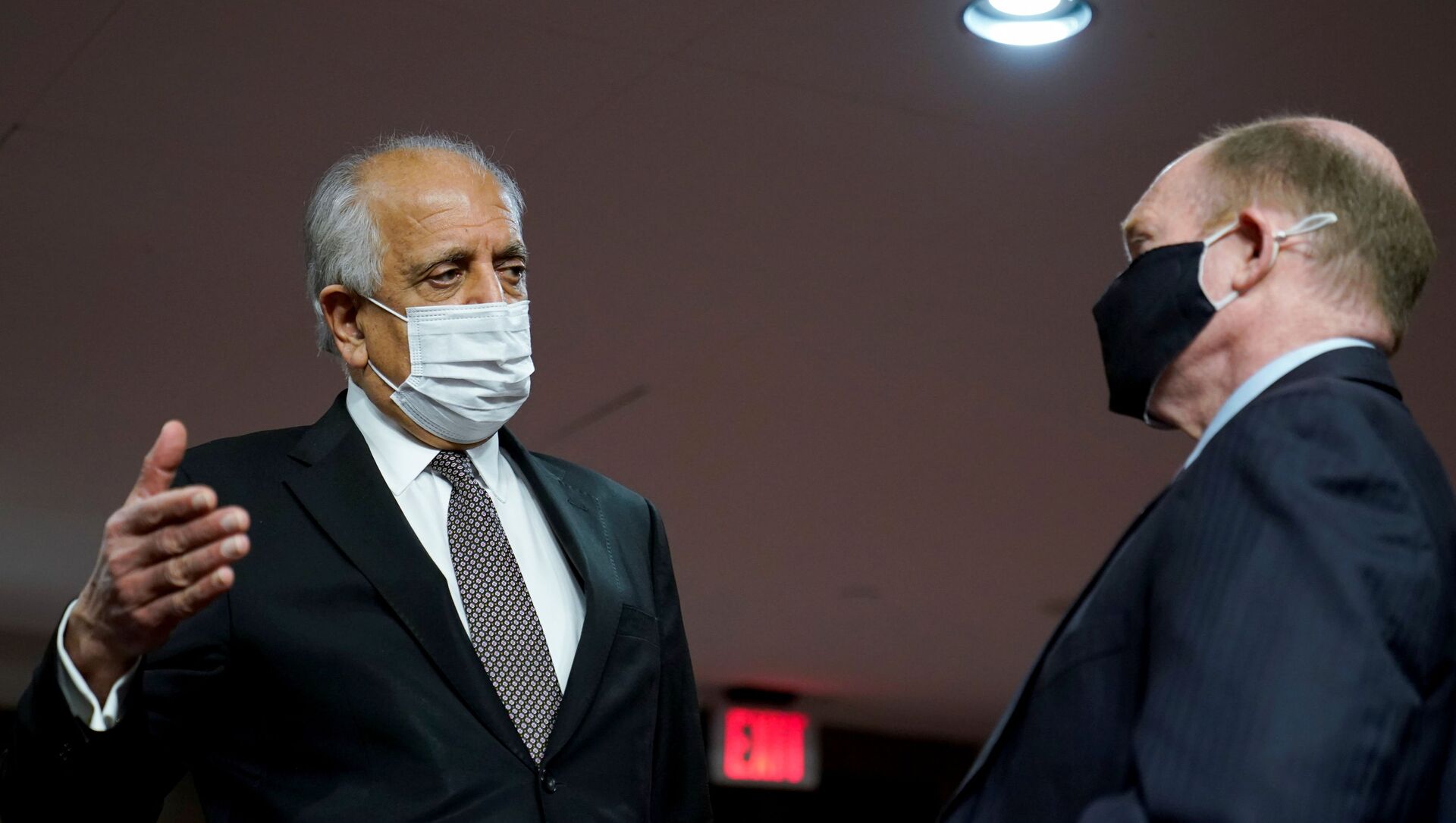 Zalmay Khalilzad, special envoy for Afghanistan Reconciliation, talks with U.S. Senator Chris Coons (D-DE), before the start of a Senate Foreign Relations Committee hearing on Capitol Hill in Washington, U.S., April 27, 2021. - Sputnik International, 1920, 27.04.2021