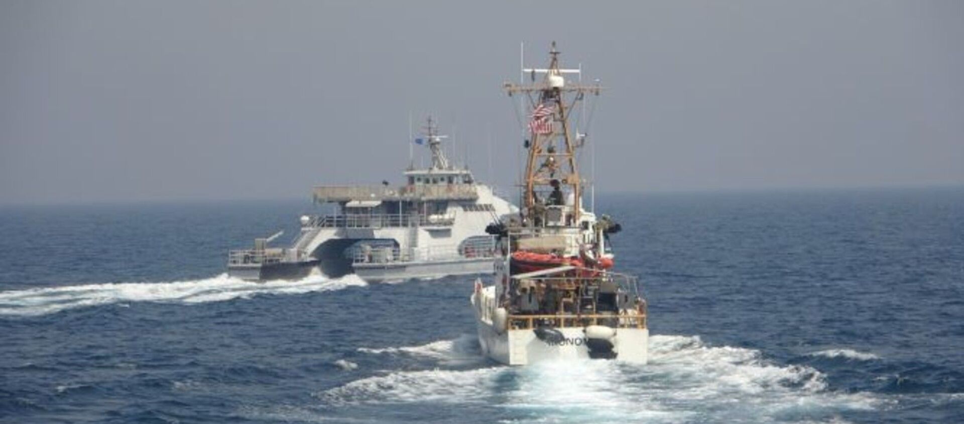 ARABIAN GULF (April 2, 2021) Iran’s Islamic Revolutionary Guard Corps Navy (IRGCN) Harth 55, left, conducted an unsafe and unprofessional action by crossing the bow of the Coast Guard patrol boat USCGC Monomoy (WPB 1326), right, as the U.S. vessel was conducting a routine maritime security patrol in international waters of the southern Arabian Gulf, Apr. 2. The USCGC ships are assigned to Patrol Forces Southwest Asia (PATFORSWA), the largest U.S. Coast Guard unit outside the United States, and operate under U.S. Naval Forces Central Command’s Task Force 55. - Sputnik International, 1920, 27.04.2021