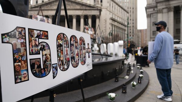 Demonstrators gather beside a presentation depicting the number 15,000 to denote estimated nursing home deaths, before a rally decrying New York Governor Andrew Cuomo's handling of the previous year's outbreak of COVID-19, in New York. - Sputnik International