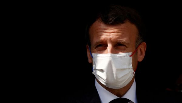 French President Emmanuel Macron, wearing a protective face mask, visits a child psychiatry department at Reims hospital to discuss the psychological impact of the COVID-19 crisis and the lockdown on children and teenagers in France, April 14, 2021.  - Sputnik International