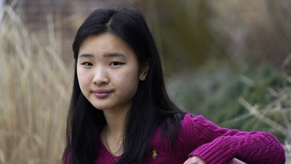 High school student Grace Hu, 16, of Sharon, Mass., stands for a photograph near Sharon High School, Sunday, April 11, 2021, in Sharon. Hu, who plans to to go back to in-person classes in April, helped organize a rally in Boston in early April against anti-Asian hate, but said she's not concerned about facing vitriol when her school reopens fully. - Sputnik International