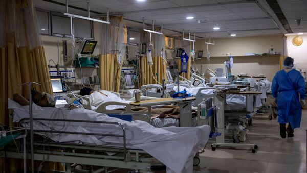 Patients suffering from the coronavirus disease (COVID-19) are seen inside the ICU ward at Holy Family Hospital in New Delhi, India - Sputnik International