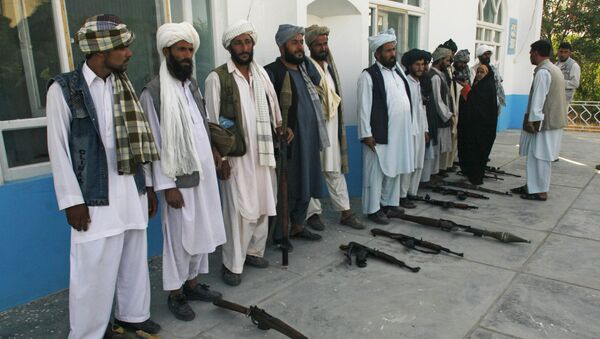 Former Taliban fighters stand in line as they surrender their weapons to Afghan authorities in Herat, west of Kabul, Afghanistan, Saturday, June 19, 2010.  - Sputnik International