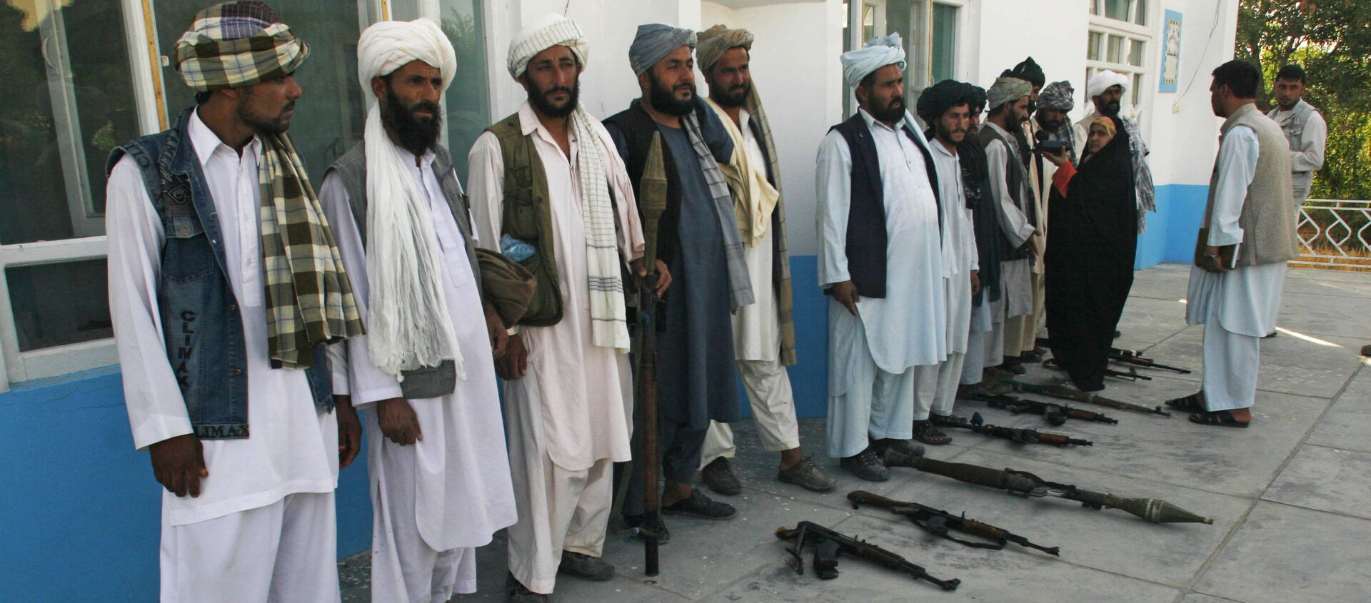 Former Taliban fighters stand in line as they surrender their weapons to Afghan authorities in Herat, west of Kabul, Afghanistan, Saturday, June 19, 2010.  - Sputnik International, 1920, 16.06.2021