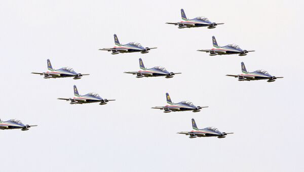 The Italian Air Force Frecce Tricolori acrobatic squad performs in Rivolto,near Udine, Italy, Thursday, May 1, 2008 on the occasion of the traditional season opening. - Sputnik International