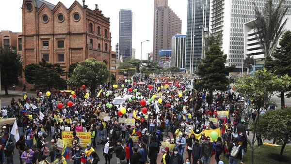 Protesters march during a national strike against a government-proposed tax reform, in Bogota, Colombia, Wednesday, April 28, 2021 - Sputnik International