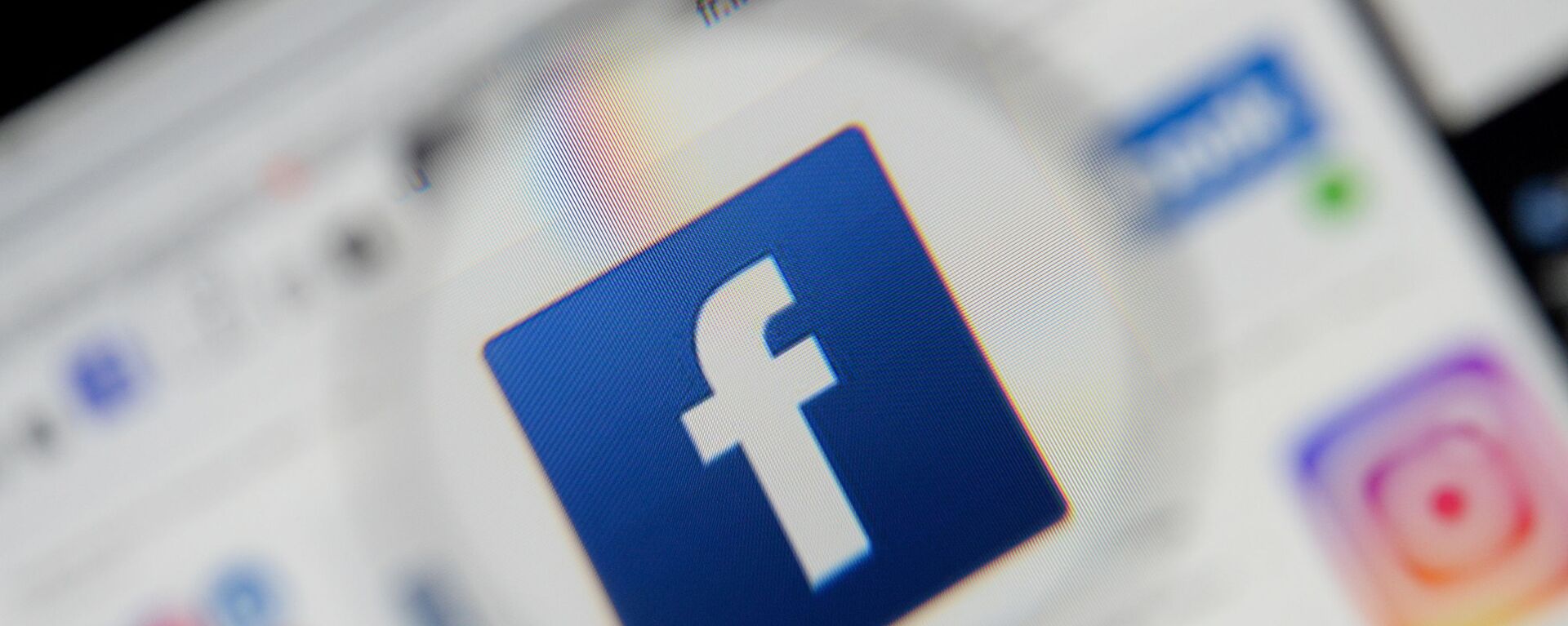 The Facebook logo is seen on a screen in this picture illustration taken December 2, 2019. - Sputnik International, 1920, 17.07.2021