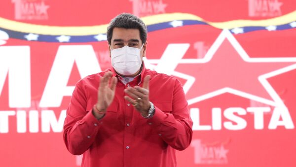Venezuelan President Nicolas Maduro applauds during an event to mark May Day, in Caracas, Venezuela May 1, 2021. - Sputnik International