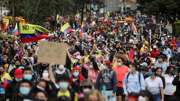 Demonstrators take part in a protest against the tax reform of President Ivan Duque's government in Bogota, Colombia, May 1, 2021. - Sputnik International