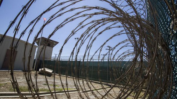 In this Wednesday, April 17, 2019 file photo reviewed by U.S. military officials, the control tower is seen through the razor wire inside the Camp VI detention facility in Guantanamo Bay Naval Base, Cuba. - Sputnik International