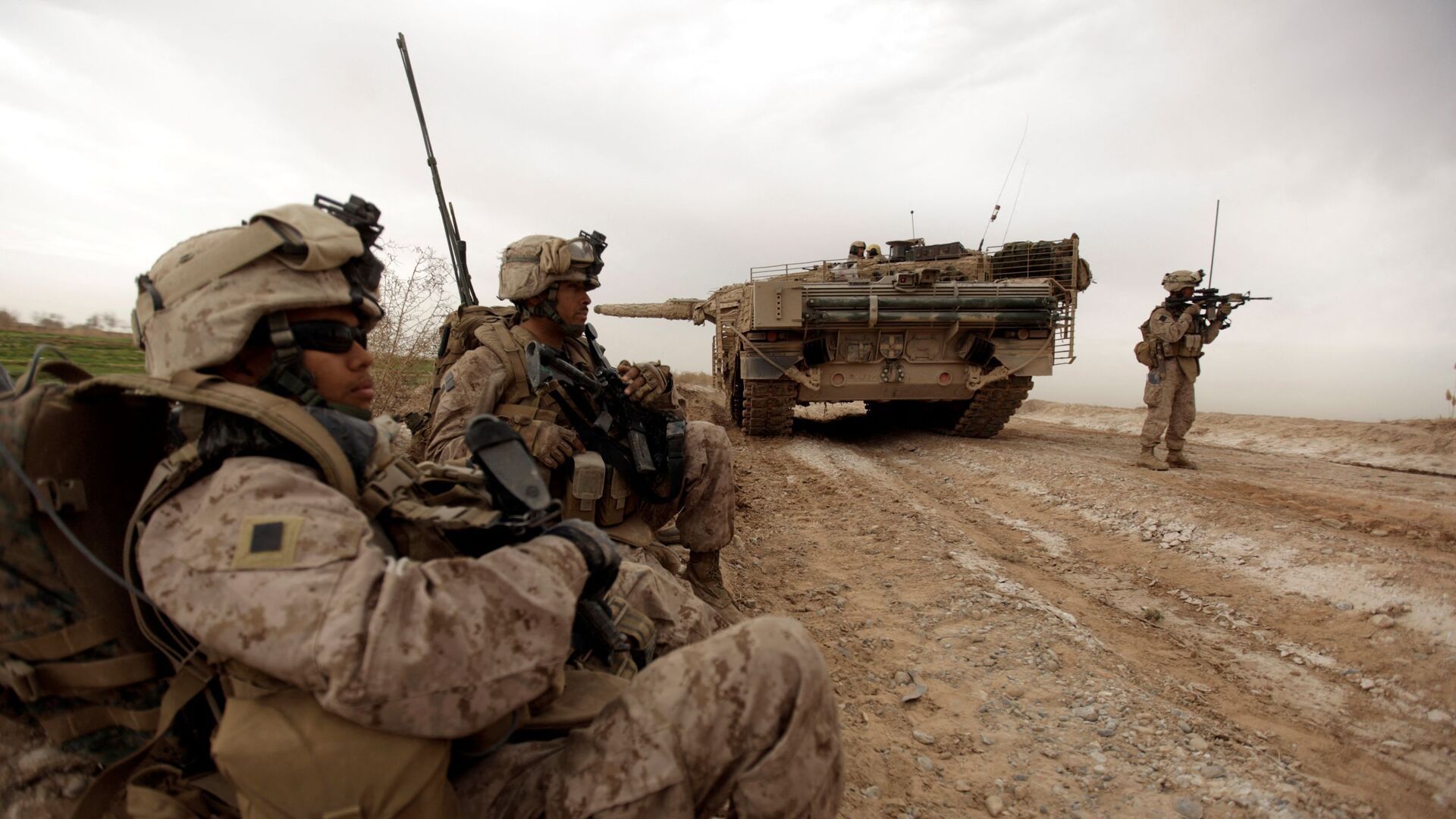 In this file photo taken on February 21, 2010, US marines with 1/3 marine Charlie Company patrol past a Danish army Leopard 2A5EK tank as they clear Improvised Explosive Device (IED)s from a main route in Trikh Nawar on the North Eastern outskirts of Marjah in Afghanistan  - Sputnik International, 1920, 08.06.2021