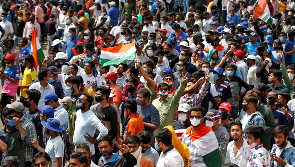 FILE PHOTO: Fans react as they wait to enter the Narendra Modi Stadium before the start of the third test match between India and England in Ahmedabad, India, February 24, 2021. - Sputnik International