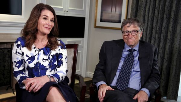 Microsoft co-founder Bill Gates and his wife Melinda sit during an interview in New York - Sputnik International