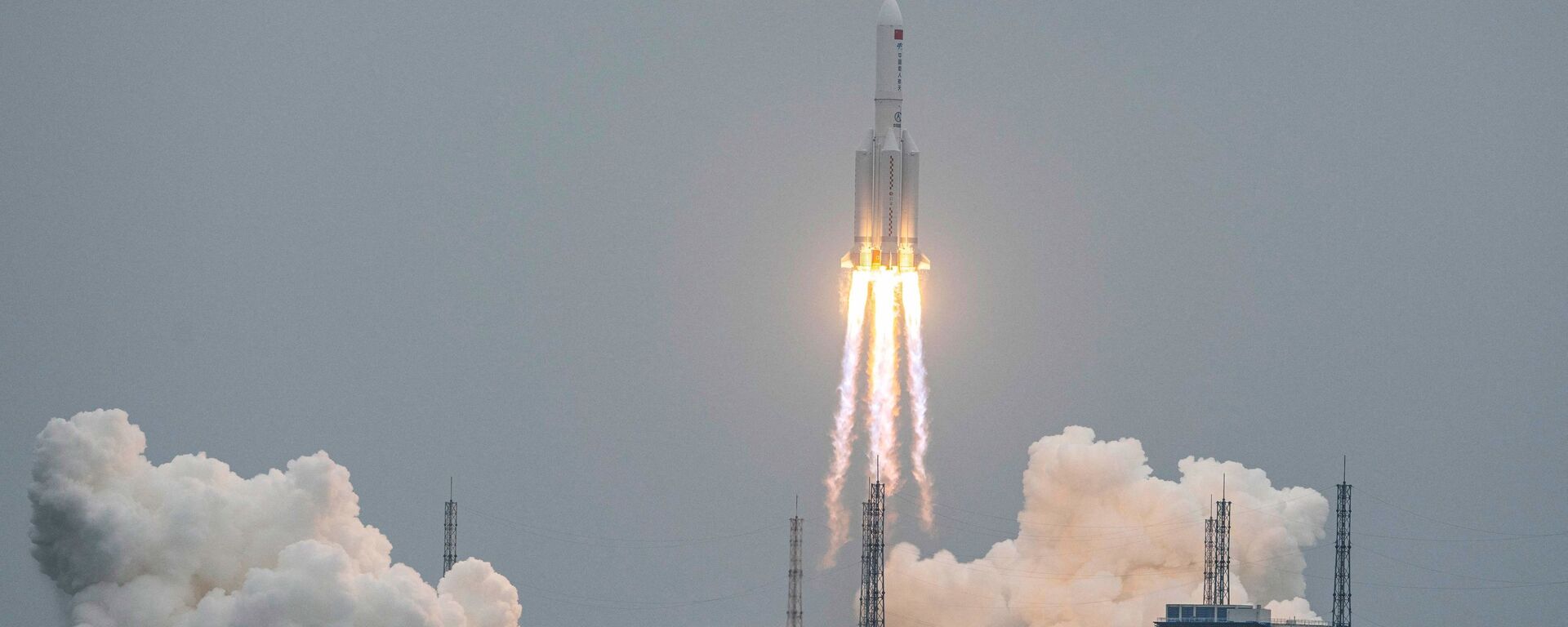 A Long March 5B rocket, carrying China's Tianhe space station core module, lifts off from the Wenchang Space Launch Center in southern China's Hainan province on April 29, 2021.  - Sputnik International, 1920, 30.05.2023