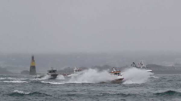 French fishing boats leave the Jersey waters following their protest in front of the port of Saint Helier off the British island of Jersey to draw attention to what they see as unfair restrictions on their ability to fish in UK waters after Brexit, on May 6, 2021. - Sputnik International