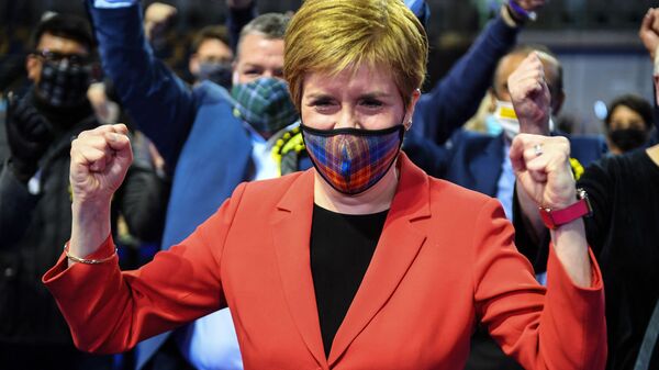 Scotland's First Minister and leader of the Scottish National Party (SNP), Nicola Sturgeon reacts after being declared the winner of the Glasgow Southside seat at Glasgow counting centre in the Emirates Arena in Glasgow on May 7, 2021, during counting for the Scottish parliament elections.  - Sputnik International