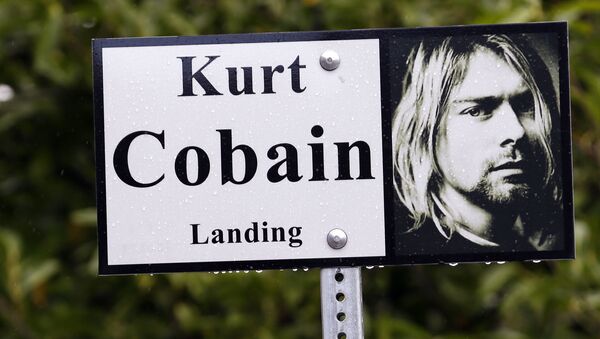 In this photo taken 23 September 2013, a sign marks the location of Kurt Cobain Landing, a tiny park blocks from the childhood home of Kurt Cobain, the late frontman of Nirvana, in Aberdeen, Washington. - Sputnik International