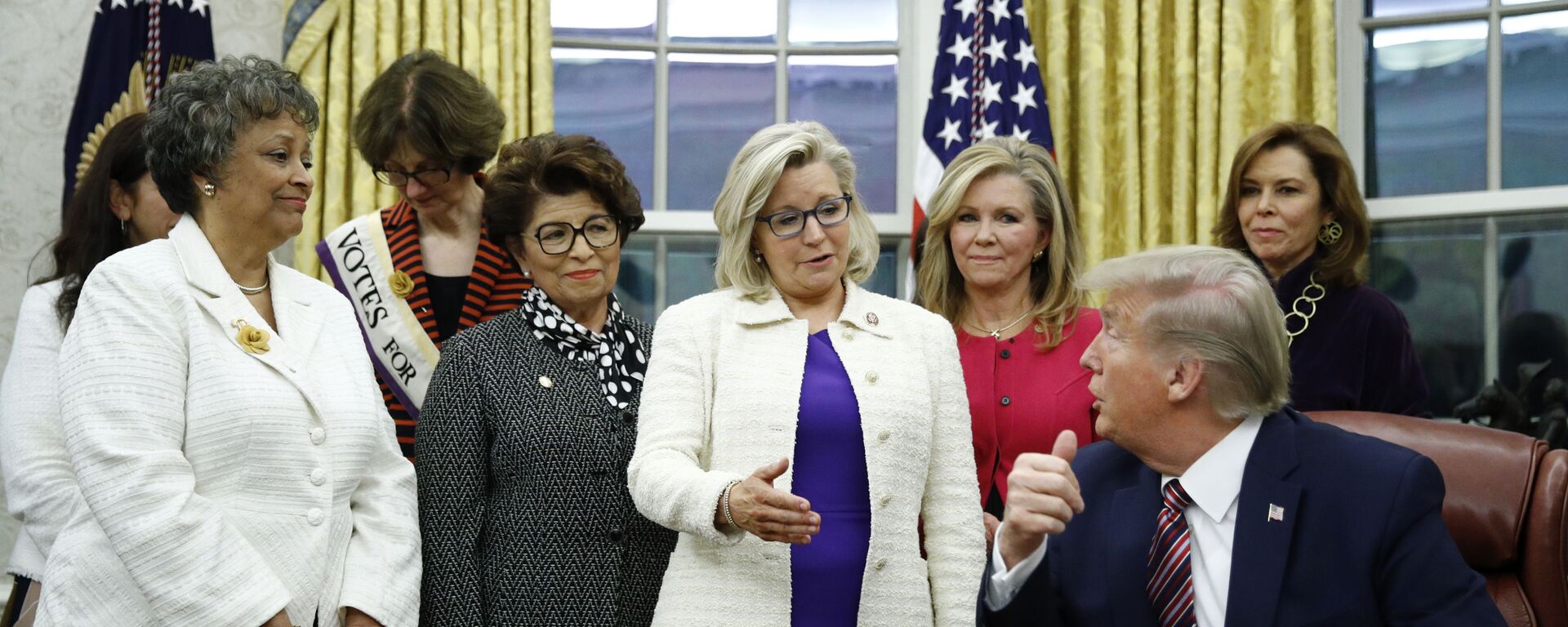 Rep. Liz Cheney, R-Wyo., center, speaks with President Donald Trump during a bill signing ceremony for the Women's Suffrage Centennial Commemorative Coin Act in the Oval Office of the White House, Monday, Nov. 25, 2019, in Washington. - Sputnik International, 1920, 04.12.2023