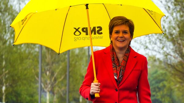 Scotland's First Minister and leader of the Scottish National Party (SNP), Nicola Sturgeon gestures on congratulating candidate Kaukab Stewart after she was elected MSP for Glasgow Kelvin in the Scottish Parliamentary Election, in Glasgow on May 8, 2021. - Sputnik International