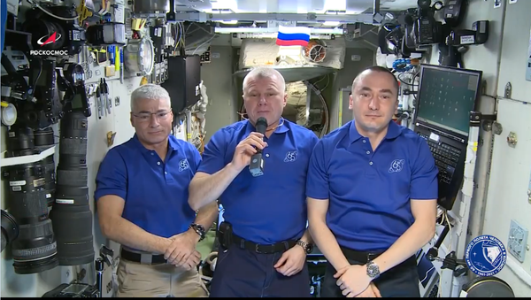 A screenshot from a video address by the ISS crew congratulating all for the 76th anniversary of the victory in World War II. - Sputnik International