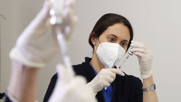 A medical worker prepares a dose of Russia's Sputnik V vaccine for COVID-19, at the San Marino State Hospital, in San Marino, Friday, April 9, 2021 - Sputnik International