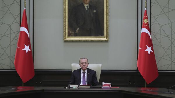Turkey's President Recep Tayyip Erdogan, backdropped by a painting depicting modern Turkey's founder Mustafa Kemal Ataturk, chairs his government's cabinet in Ankara, Turkey, Monday, April 26, 2021. - Sputnik International
