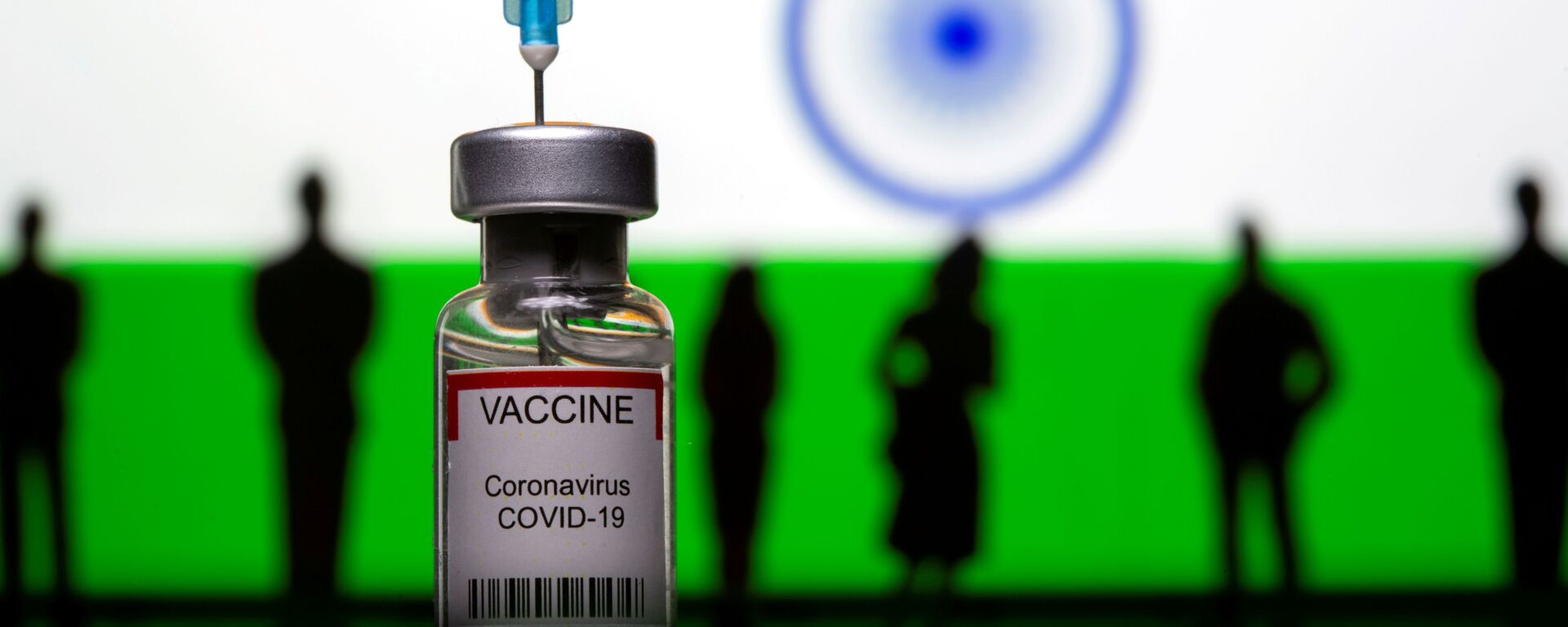 3D-printed small toy figurines, a syringe and vial labelled coronavirus disease (COVID-19) vaccine are seen in front of India flag - Sputnik International, 1920, 13.05.2021