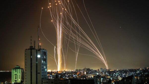 Rockets are launched from Gaza city, controlled by the Palestinian Hamas movement, in response to an Israeli air strike on a 12-storey building in the city, towards the coastal city of Tel Aviv, on May 11, 2021.  - Sputnik International