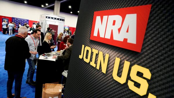 Attendees sign up at the National Rifle Association (NRA) booth at the Conservative Political Action Conference (CPAC) annual meeting at National Harbor in Oxon Hill, Maryland, U.S., February 27, 2020. - Sputnik International
