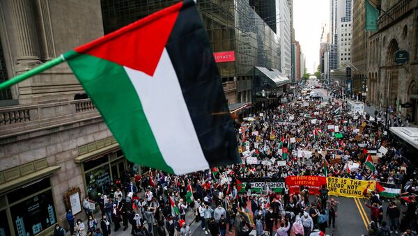 Pro-Palestinian supporters march to Times Square as they protested near the Israeli Consulate following a flare-up of Israeli-Palestinian violence in the Manhattan borough of New York City, New York, U.S., May 11, 2021. - Sputnik International