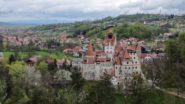 Bran Castle towers above Bran commune, in Brasov county, Romania, May 8, 2021. Picture taken with a drone.  - Sputnik International
