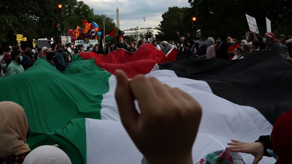 Pro-Palestinian demonstrators take part in a protest titled “Stop Jerusalem Expulsions, save Sheikh Jarrah” outside of the White House in Black Lives Matter Plaza after marching from the U.S. State Department building in Washington, U.S. May 11, 2021. - Sputnik International