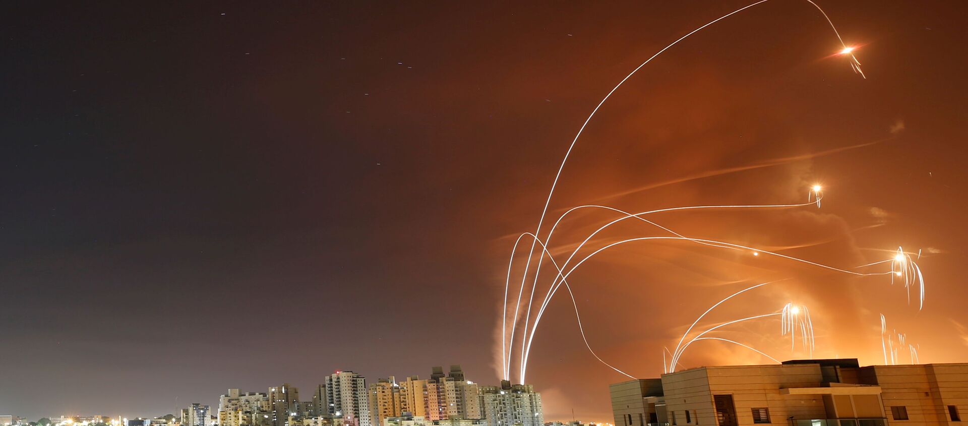 Streaks of light are seen as Israel's Iron Dome anti-missile system intercept rockets launched from the Gaza Strip towards Israel, as seen from Ashkelon, Israel May 12, 2021. - Sputnik International, 1920, 31.05.2021