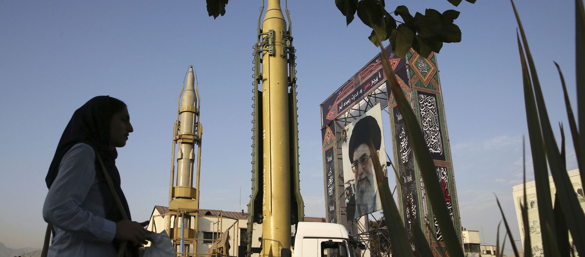 In this Sept. 24, 2017 file photo, surface-to-surface missiles and a portrait of the Iranian Supreme Leader Ayatollah Ali Khamenei are displayed by the Revolutionary Guard in an exhibition marking the anniversary of outset of the 1980s Iran-Iraq war, at Baharestan Square in Tehran, Iran. - Sputnik International, 1920