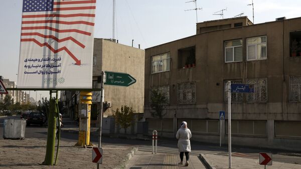 A pedestrian walks past an anti-U.S. billboard, in Tehran, Iran, Tuesday, Nov. 3, 2020 - Sputnik International