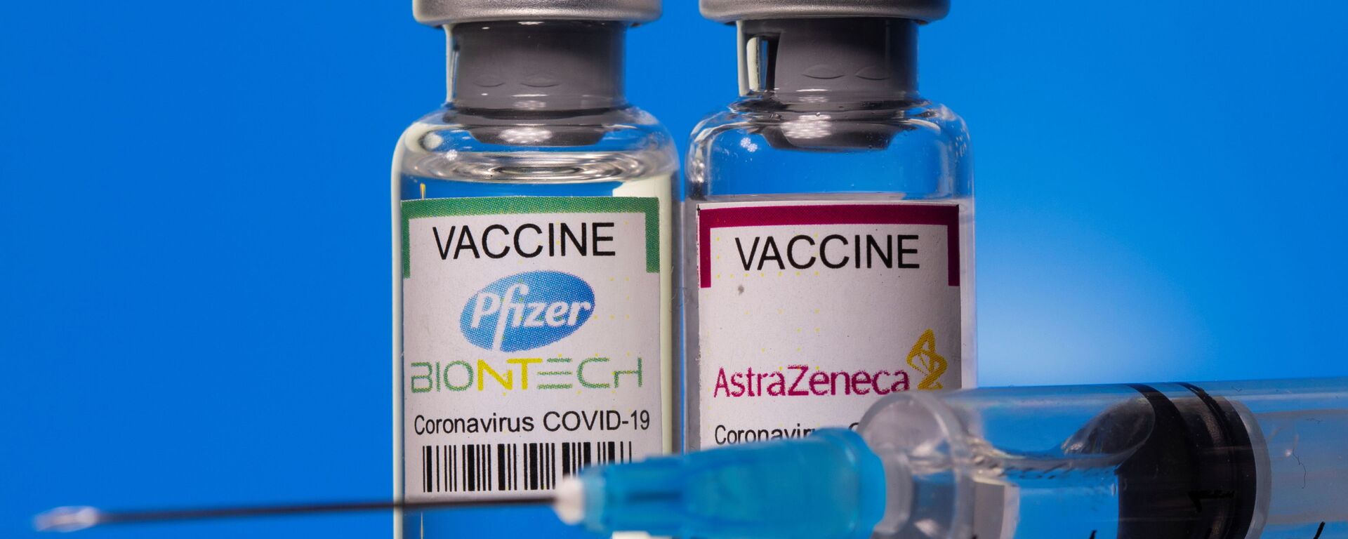  Vials with Pfizer-BioNTech and AstraZeneca coronavirus disease (COVID-19) vaccine labels are seen in this illustration picture taken March 19, 2021 - Sputnik International, 1920, 23.05.2021