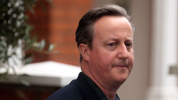 Former British Prime Minister David Cameron leaves his home in London - Sputnik International