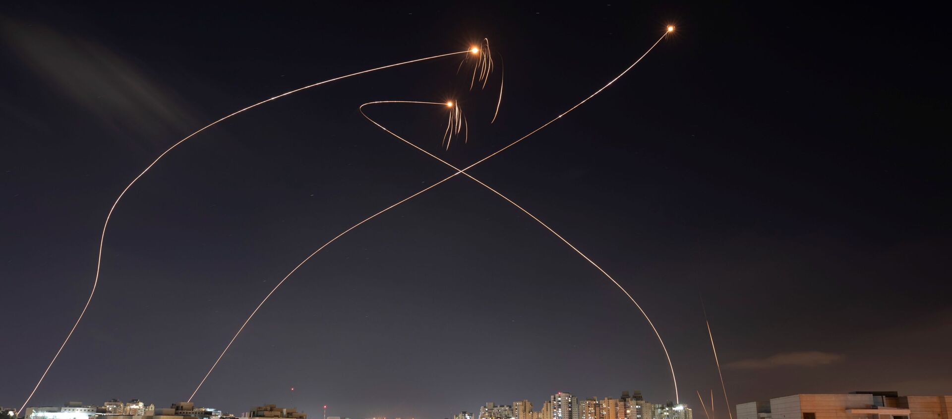 Streaks of light are seen as Israel's Iron Dome anti-missile system intercept rockets launched from the Gaza Strip towards Israel, as seen from Ashkelon, Israel May 13, 2021. - Sputnik International, 1920