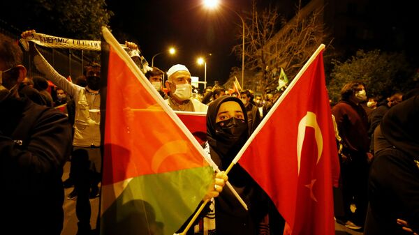 Demonstrators march with Turkish and Palestinian flags during a protest against Israel in Ankara, Turkey late May 10, 2021 - Sputnik International