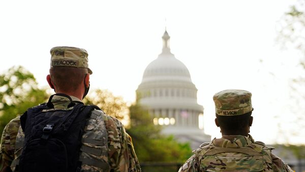 Members of the National Guard patrol the U.S. Capitol grounds prior to U.S. President Joe Biden's first address to a joint session of the U.S. Congress in Washington, U.S., April 28, 2021. - Sputnik International