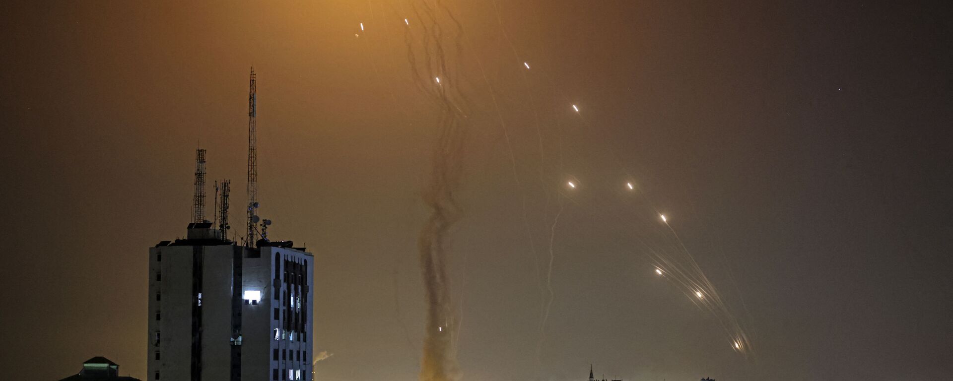 A rocket launched from Gaza city controlled by the Palestinian Hamas movement, is intercepted by Israel's Iron Dome aerial defence system, on May 11, 2021. - Sputnik International, 1920, 02.05.2023