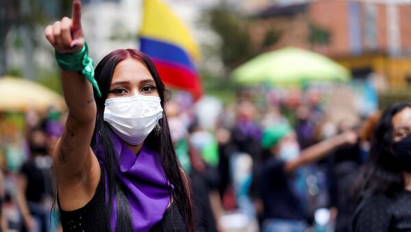 A woman gestures during a protest against sexual assault by the police and the excess of public force against peaceful protests, in Bogota, Colombia, May 15, 2021. - Sputnik International