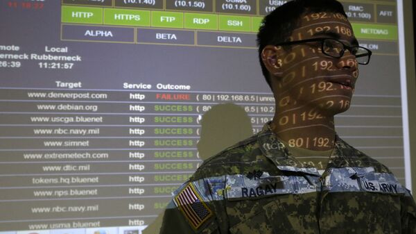 United States Military Academy cadet Kiefer Ragay stands in a projection of data results, as he talks to fellow cadets at the Cyber Research Center at the United States Military Academy in West Point, N.Y., Wednesday, April 9, 2014.  - Sputnik International